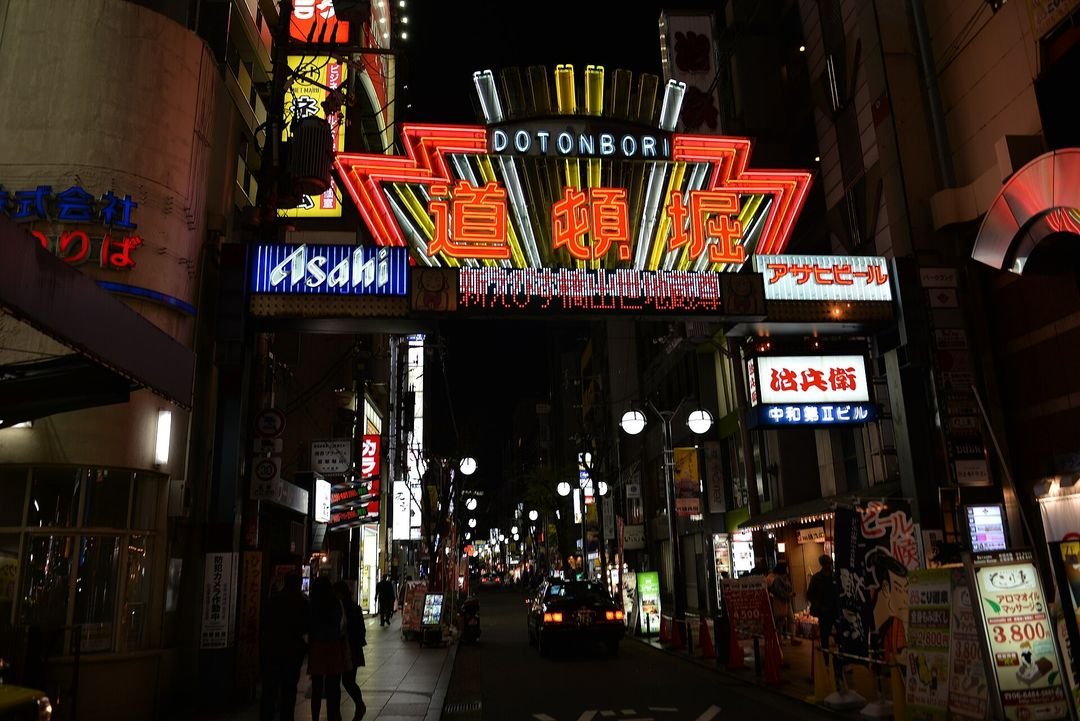 The Dotonbori canal in Osaka, neon signage reflected in the water